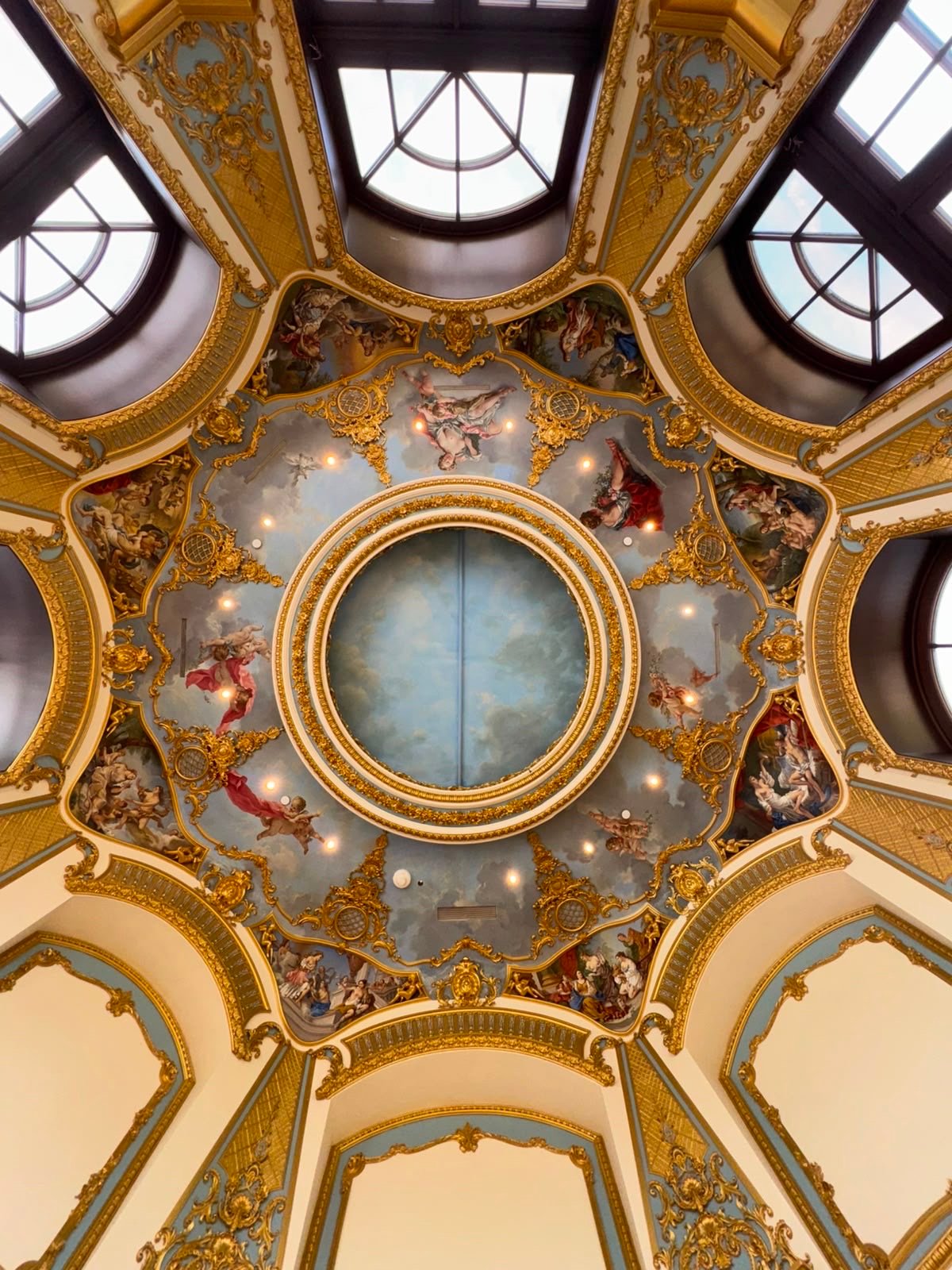 Gilded dome with hand-painted sky mural and cherubs by Kim Delaney