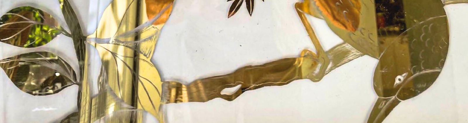 Gilded botanical glass detail, the natural sensibility behind Delaney Shell Designs